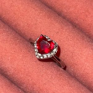 Ruby red heart sterling silver ring with cz around heart. Size 7.